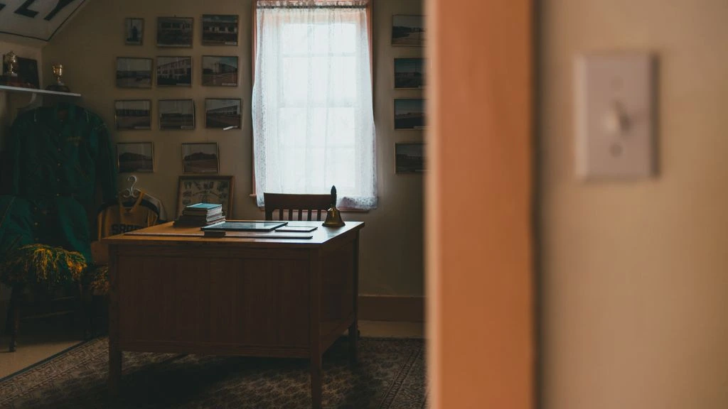 Two operators reviewing a hotel night audit in a back-office workspace